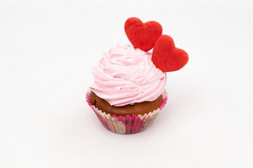 Valentine's Day. Cupcakes with hearts on a white background for Valentine's Day.