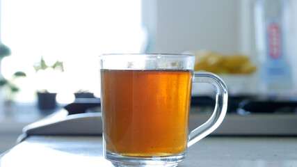 Image with Making a Hot and Aromatic Tea with Sugar and Fresh Lemon Using Natural Tea Leafs