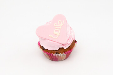 Valentine's Day. Cupcakes with hearts on a white background for Valentine's Day.