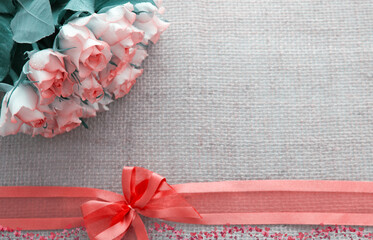 Valentine's day background with roses and loop isolated on brown .