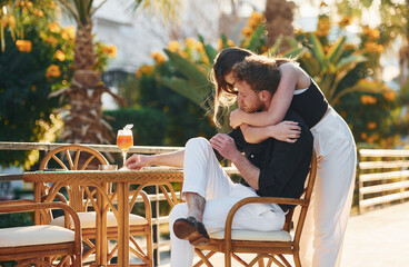 Closeness of the people. Happy young couple is together on their vacation. Outdoors at sunny daytime