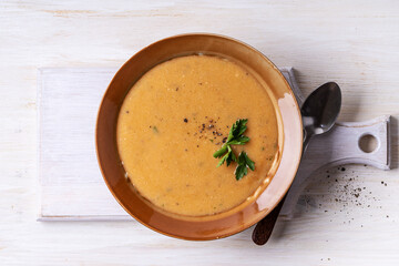 Bowl of bean soup on white wood, healthy vegan meal