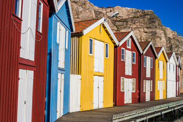 A cityscape of some colourful beach huts in Smögen, on the Swedish west coast, Sweden