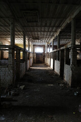 interior of old dirty abandoned stable