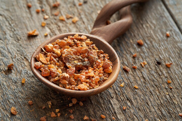 Myrrh resin on a spoon on a table