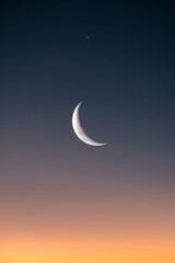 Obraz na płótnie Canvas half moon in sunset sky