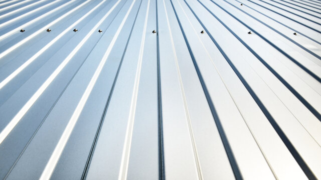 Low Angle View Of The Silvery Warehouse Wall. Metal Siding, Texture, Close-up. Panoramic Image, Graphic Resources, Copy Space