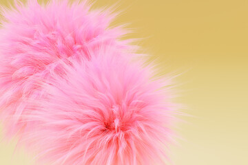 Pink fur balls on a yellow background, 3d render