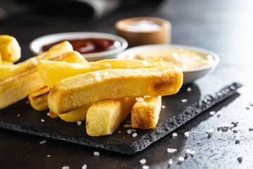 Big french fries. Fried potato chips.