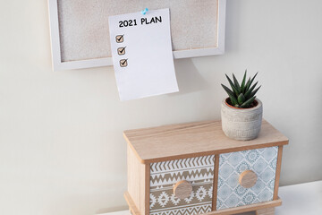 note paper 2021 goals text on it to apply new year resolutions and plan.	