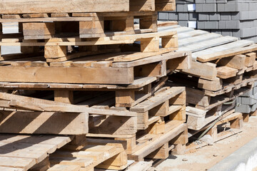 empty wooden pallets and new construction tiles