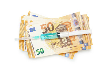 syringe on euro banknotes