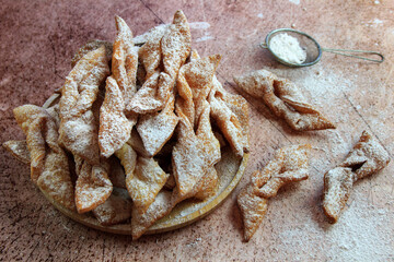 Faworki (angel wings) sprinkled with powdered sugar - traditional Polish carnival delicacy