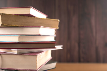 Pile of the books on the table. Wisdom of the world hidden in the book. Education. Studying. 