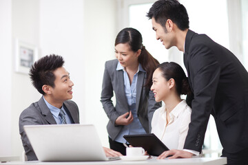 Group of business people discussing in office