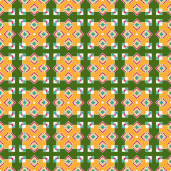 Bright seamless ethnic pattern, a beautiful intersection of colored rhombuses and squares, on a green background.