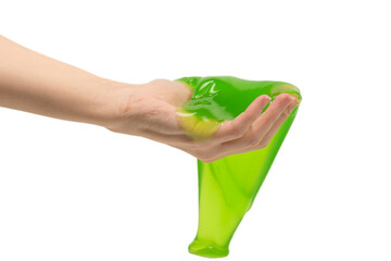 Green slime toy in woman hand isolated on white background.