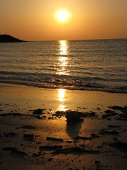 Fototapeta na wymiar Orange Sunset on the beach