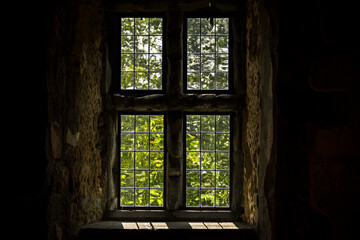 Vintage window and dark shadows in old style building