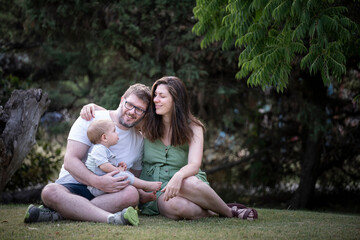 family portrait on a summer afternoon in the park