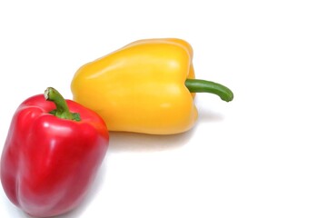 Blurred a pair of sweet red yellow peppers on white isolated background with copy space
