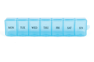 Blue plastic organizer, for pills isolated on white background. Close-up on compartments pill case with clip lids medicine. Daily vitamins and supplements dosage routine concept.