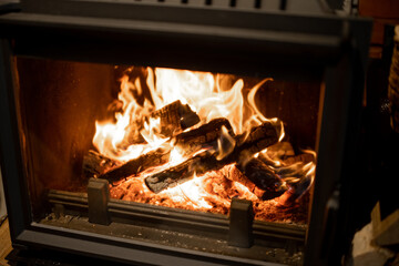 Close-up of a burning firewoods in the fireplace