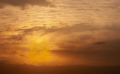 Dramatic winter sunrise with cloudy orange sky in winter