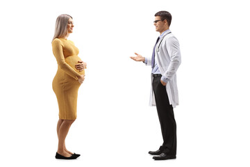 Full length profile shot of a doctor giving advice to a pregnant woman