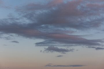 Sunset sky with dark blue, purple clouds