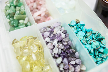 Decorative amethyst stones in container.