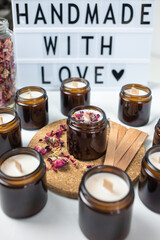 Handmade ecological and vegan soy wax candles with wooden wick. Amber and opaque container. Cruelty-free vegan product, handmade with love. 