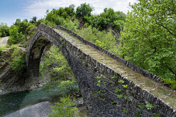 View of the traditional stone Tsipiani Bridge in Epirus, Greece.