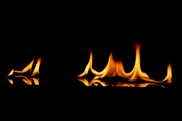fire flame with reflection in the glass on a black background