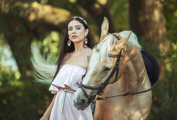 Fototapeta premium Beautyful woman in dress with horse