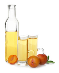 Delicious plum liquor and ripe fruits on white background. Homemade strong alcoholic beverage