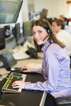 Portrait of female trader at trading desk
