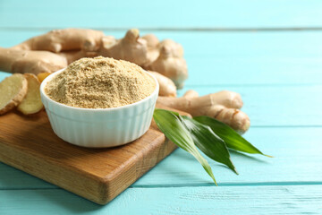 Dry and fresh ginger on light blue wooden table