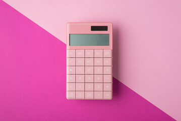 Above overhead close up view photo image of pastel pink calculator isolated over half bright backdrop