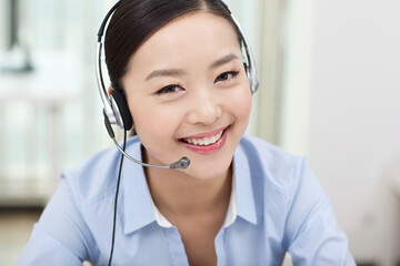 Young Female office worker wearing headset portrait