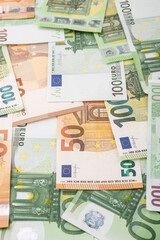Fifty and hundred euro bills spread in perspective