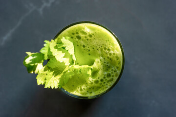 Top view of a glass of fresh celery juice