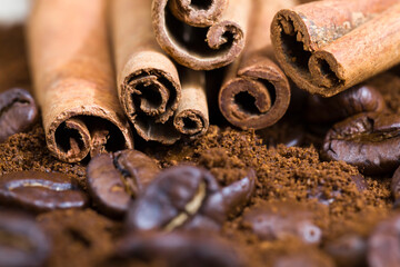 aromatic coffee beans with ground coffee powder