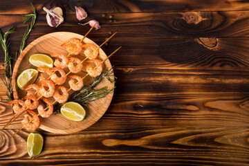 shrimp on skewers on a wooden table