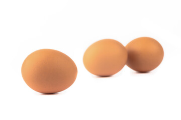 Soft focus. Three eggs on a white background.