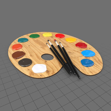 Art palette with paints and brushes