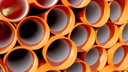 Pvc pipes and tubes stacked in the factory warehouse ready for transportation