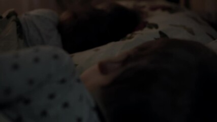 Relaxation, Sweet Dreams, Childhood, Family Concept - close up Cutaway shot Two Little preschool toddler kids Siblings brother and sister lie on Bed Covered in Blanket in nursery during night sleep