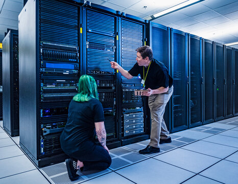 Co-workers in data center server room