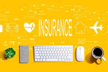 Insurance concept with a computer keyboard and a mouse